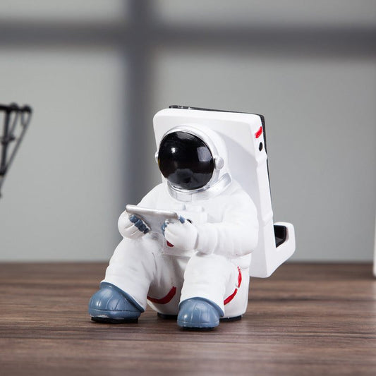 Space Spaceman Mobile Phone Desk Holder on a desk with a phone for home decor ideas
