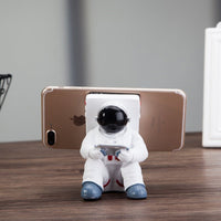 Front view of Space Spaceman Mobile Phone Desk Holder for small office decorations