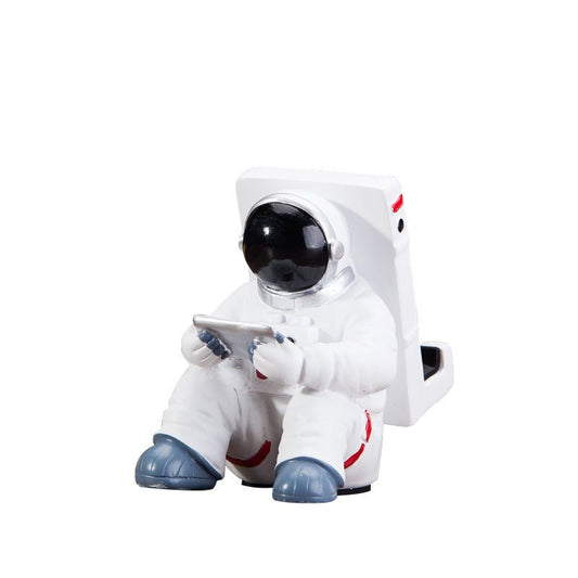 Close-up of Space Spaceman Mobile Phone Desk Holder for compact workspace organization